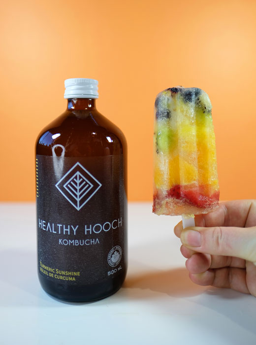 rainbow popsicles next to a bottle of healthy hooch 